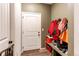 Mudroom with bench, coat hooks, and door to outside at 10303 Pitkin Ct, Commerce City, CO 80022