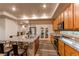 Open kitchen with island, stainless steel appliances, and pantry at 10303 Pitkin Ct, Commerce City, CO 80022