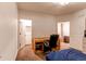 Basement bedroom with a desk, chair and large closet at 10303 Pitkin Ct, Commerce City, CO 80022