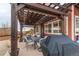 Patio with pergola, seating, and grill at 10303 Pitkin Ct, Commerce City, CO 80022