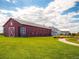 Large red barn community clubhouse with modern architectural elements at 10303 Pitkin Ct, Commerce City, CO 80022