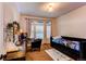 Bedroom with a daybed and a built-in desk area at 10303 Pitkin Ct, Commerce City, CO 80022