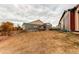 Backyard view of neighboring house and grass at 10303 Pitkin Ct, Commerce City, CO 80022