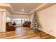 Living room with hardwood floors, large windows, and comfortable seating at 10303 Pitkin Ct, Commerce City, CO 80022