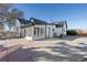 Rear view of house showing sunroom and patio area at 640 Pacific Ave, Fort Lupton, CO 80621