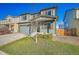 Two-story house with green exterior, two-car garage, and landscaping at 2012 Monte Vista Dr, Lochbuie, CO 80603