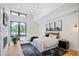 Spacious primary bedroom with a fireplace and natural light at 4107 Bryant St, Denver, CO 80211