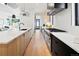 Modern kitchen with stainless steel appliances and two-toned cabinetry at 4107 Bryant St, Denver, CO 80211