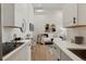 Open concept kitchen with a view of the living room at 4107 Bryant St, Denver, CO 80211