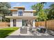 Private backyard with patio furniture and modern finishes at 4107 Bryant St, Denver, CO 80211