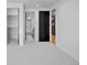 Bedroom with carpet flooring and access to a bathroom and closet at 4107 Bryant St, Denver, CO 80211