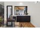 Modern wet bar with a wine cooler and access to the backyard patio at 4107 Bryant St, Denver, CO 80211