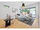 Bright living room with hardwood floors and access to the backyard at 4107 Bryant St, Denver, CO 80211