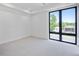 Bright bedroom with carpet flooring and large window at 4107 Bryant St, Denver, CO 80211