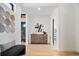 Bright entryway with light wood floors and modern decor at 4107 Bryant St, Denver, CO 80211