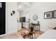 Modern kitchenette with white cabinets and a small desk at 4107 Bryant St, Denver, CO 80211
