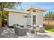 Private backyard with patio furniture and modern finishes at 4107 Bryant St, Denver, CO 80211