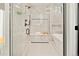 Spa-like bathroom with walk-in shower, soaking tub, and marble tile at 4107 Bryant St, Denver, CO 80211