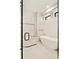 Elegant bathroom featuring a freestanding tub and marble tile at 4107 Bryant St, Denver, CO 80211