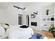 Primary bedroom with fireplace and built-in shelving at 4107 Bryant St, Denver, CO 80211