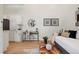 Small kitchenette with white shaker cabinets and modern appliances at 4107 Bryant St, Denver, CO 80211