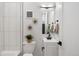 Clean bathroom with white vanity and black accents at 4107 Bryant St, Denver, CO 80211
