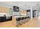 Modern kitchen with a large island, stainless steel appliances, and light wood cabinets at 4107 Bryant St, Denver, CO 80211