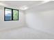 Bright bedroom with carpet flooring and large window at 4107 Bryant St, Denver, CO 80211