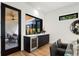Modern wet bar with a wine cooler and access to the backyard patio at 4107 Bryant St, Denver, CO 80211