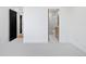 Bright bedroom with access to a full bathroom and hallway at 4107 Bryant St, Denver, CO 80211