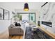 Spacious living room with a marble fireplace and backyard access at 4107 Bryant St, Denver, CO 80211