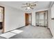 Well-lit bedroom featuring a large closet and access to the bathroom at 17 Dartmouth Cir, Longmont, CO 80503