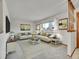 Spacious living room with light beige sofas and a large area rug at 17 Dartmouth Cir, Longmont, CO 80503