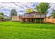 Large backyard with expansive deck and storage shed at 6039 W Fair Dr, Littleton, CO 80123