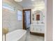 Elegant bathroom with a freestanding tub and marble shower at 6039 W Fair Dr, Littleton, CO 80123