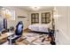 Multipurpose bedroom with gaming setup and comfortable bed at 6039 W Fair Dr, Littleton, CO 80123