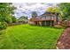 Large grassy backyard with a deck and raised patio at 6039 W Fair Dr, Littleton, CO 80123