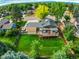 Aerial view showcasing the house, backyard, and neighborhood at 6039 W Fair Dr, Littleton, CO 80123