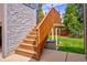 Exterior stairs leading to a raised deck in the backyard at 6039 W Fair Dr, Littleton, CO 80123