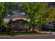 Ranch style home with mature trees and landscaping at 6039 W Fair Dr, Littleton, CO 80123