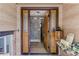 Inviting entryway with double doors and a stone accent wall at 6039 W Fair Dr, Littleton, CO 80123