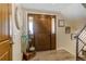 Bright entryway with wood door and tile flooring at 6039 W Fair Dr, Littleton, CO 80123