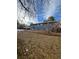 View of the back of the house and expansive backyard at 16032 E Floyd Ave, Aurora, CO 80013