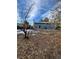 Spacious backyard with mature trees and a partially visible home at 16032 E Floyd Ave, Aurora, CO 80013