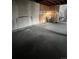 Unfinished basement with large open space, concrete floor, and a window for natural light at 16032 E Floyd Ave, Aurora, CO 80013