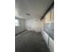 Unfinished basement area with concrete floor and partial walls at 16032 E Floyd Ave, Aurora, CO 80013
