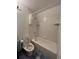 Clean bathroom with a bathtub, toilet and shower at 16032 E Floyd Ave, Aurora, CO 80013