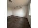 Simple bedroom with carpeted floor, window, and light fixture at 16032 E Floyd Ave, Aurora, CO 80013