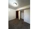 Spacious bedroom with double closet and carpet flooring at 16032 E Floyd Ave, Aurora, CO 80013