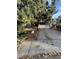 Ranch style home with attached two-car garage and mature trees at 16032 E Floyd Ave, Aurora, CO 80013